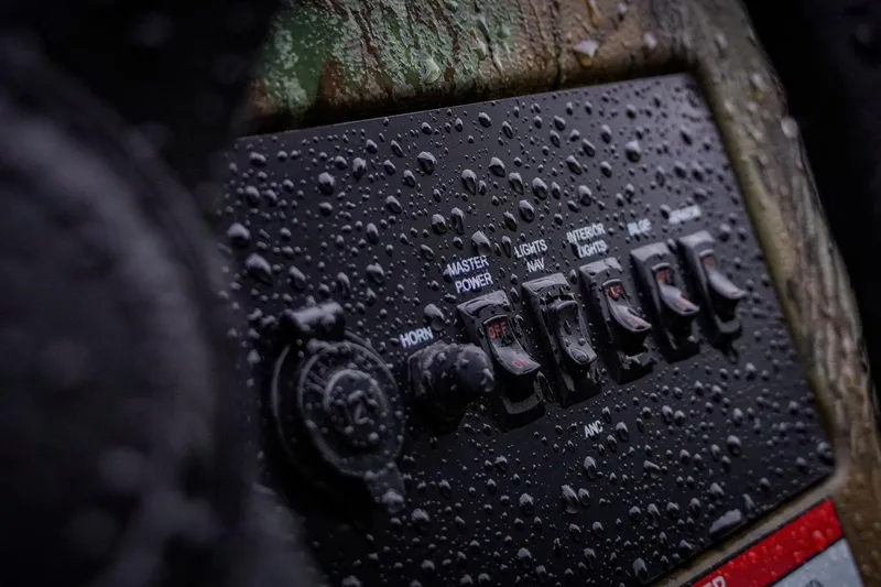 Slide: The Image of Wet control panel of G3 17SC 2026 boat with switches and raindrops. - 7