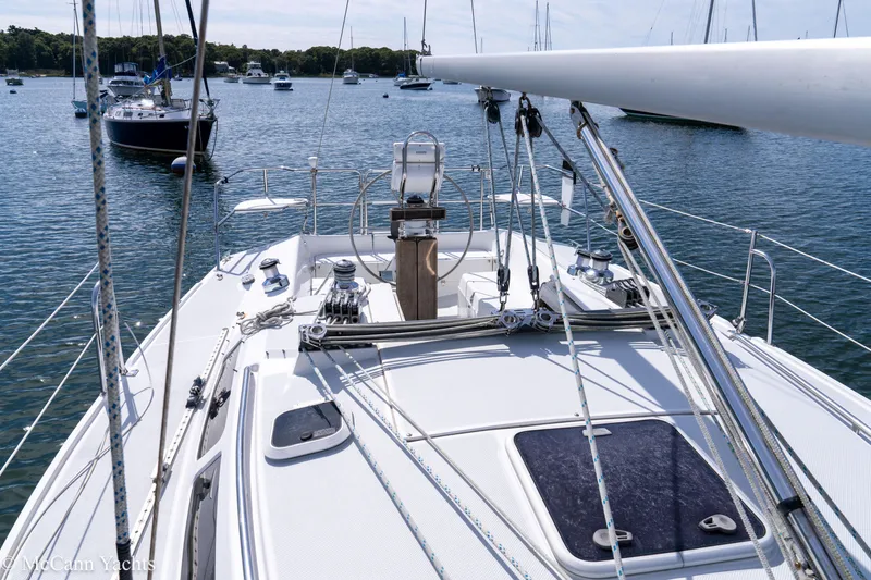 Slide: The Image of Catalina 320 sailboat on calm water, surrounded by other boats, 2003 model. - 39