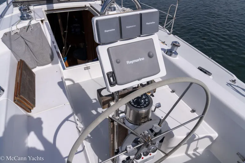 Slide: The Image of Cockpit of 2003 Catalina 320 sailboat with Raymarine navigation equipment. - 42