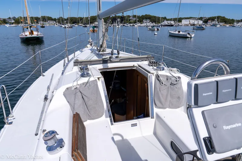 Slide: The Image of Sailboat deck view of 2003 Catalina 320, moored in a scenic harbor. - 9