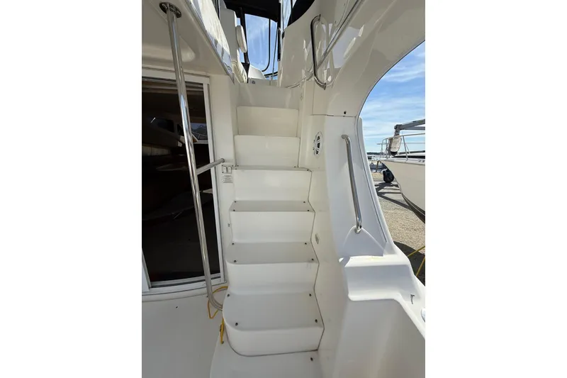 Slide: The Image of Staircase on 2005 Silverton 38 Sport Bridge yacht, leading to upper deck. - 18