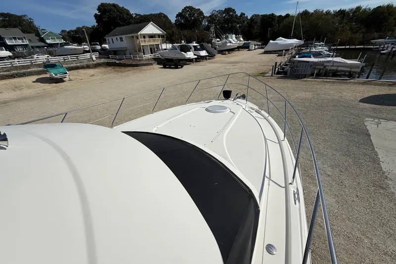 Slide: The Image of 2005 Silverton 38 Sport Bridge yacht on dry dock, surrounded by other boats. - 27