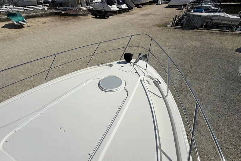 Slide: The Image of 2005 Silverton 38 Sport Bridge yacht deck view at marina. - 28