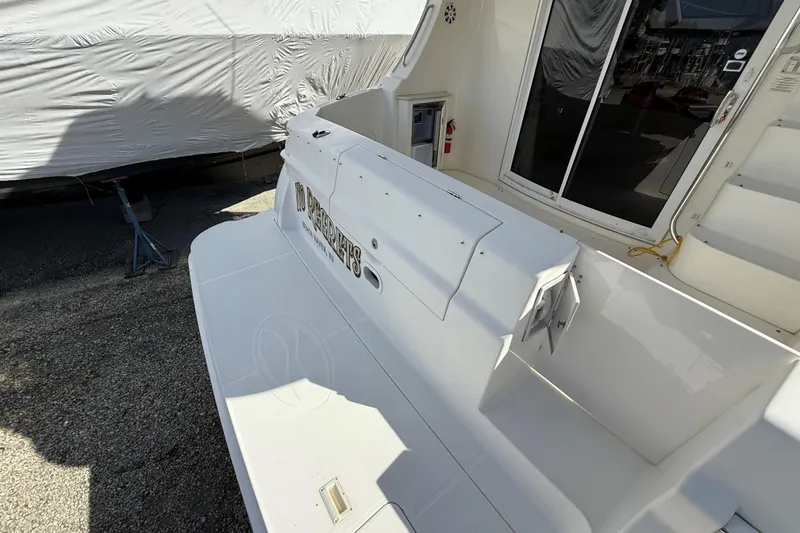 Slide: The Image of 2005 Silverton 38 Sport Bridge yacht, rear deck view, docked with cover. - 6