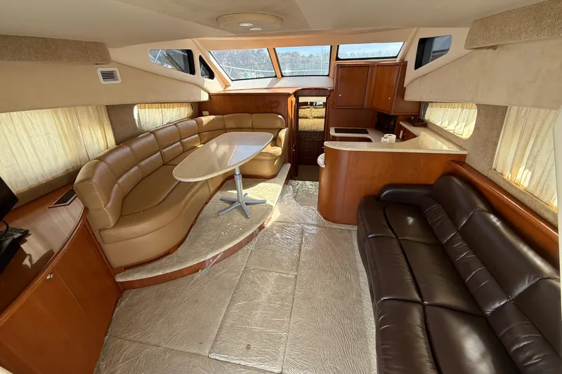 Slide: The Image of Luxurious interior of a 2005 Silverton 38 Sport Bridge yacht with leather seating and modern amenities. - 9