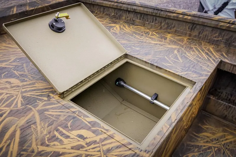 Slide: The Image of Open storage compartment in 2026 G3 17DK boat with camouflage design. - 10