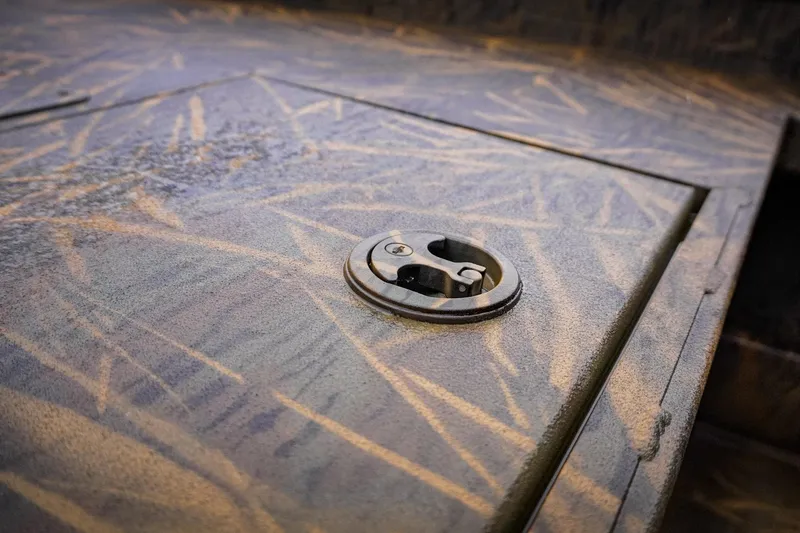 Slide: The Image of Camouflage-patterned surface with a circular latch on a 2026 G3 17DK model. - 11