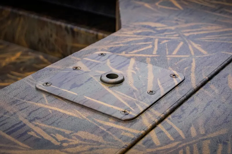 Slide: The Image of Close-up of a 2026 G3 17DK boat deck with camouflage pattern and metal fixture. - 15