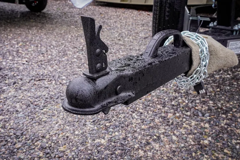 Slide: The Image of Trailer hitch of G3 17DK 2026 model with safety chain on gravel surface. - 16