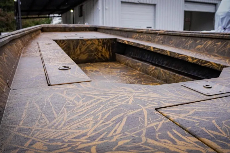 Slide: The Image of 2026 G3 17DK boat interior with camouflage pattern, showcasing storage compartments. - 6