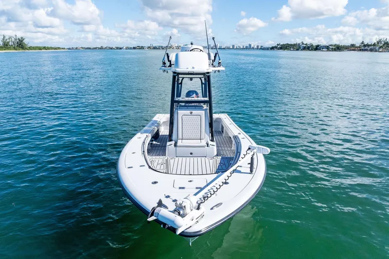 Slide: The Image of 2020 Barker Boatworks 26 Open on calm water under a blue sky. - 10