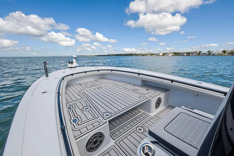 Slide: The Image of 2020 Barker Boatworks 26 Open on water, featuring spacious deck and scenic view. - 11