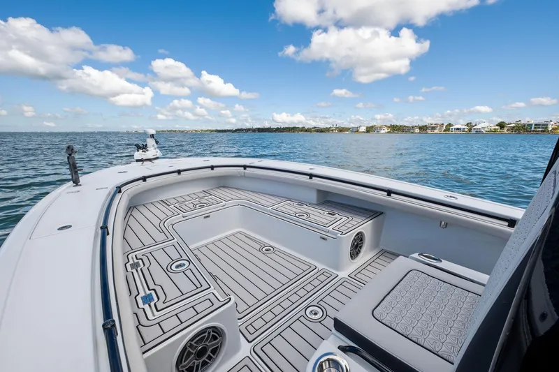 Slide: The Image of 2020 Barker Boatworks 26 Open on water, featuring spacious deck and scenic view. - 12