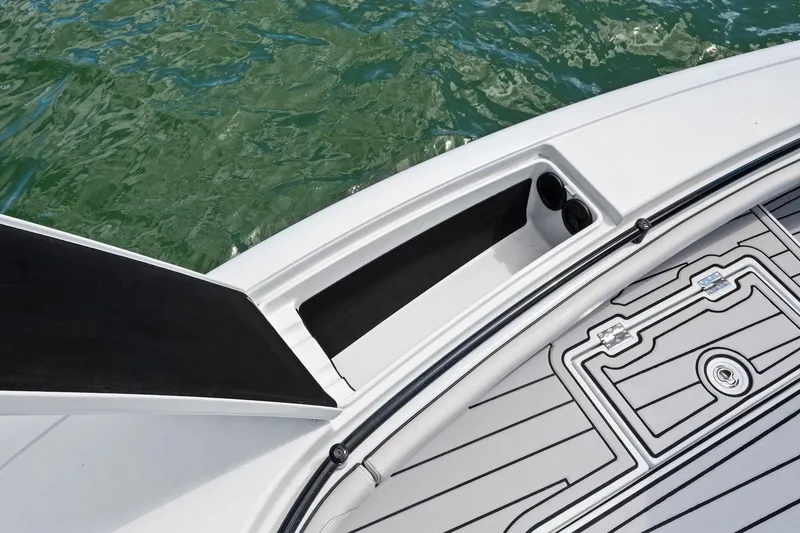 Slide: The Image of 2020 Barker Boatworks 26 Open deck detail with storage compartment and cup holders. - 15