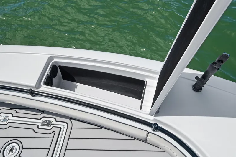 Slide: The Image of 2020 Barker Boatworks 26 Open, deck view with storage compartment, on water. - 16