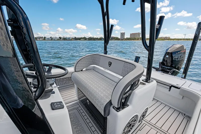 Slide: The Image of 2020 Barker Boatworks 26 Open on water, featuring sleek seating and powerful engine. - 23