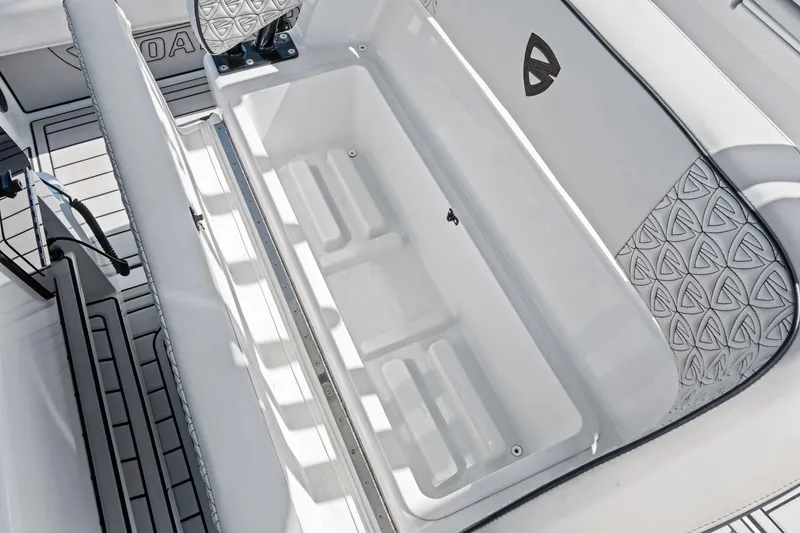 Slide: The Image of 2020 Barker Boatworks 26 Open interior with spacious storage compartment and patterned seating. - 25