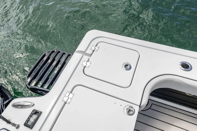 Slide: The Image of 2020 Barker Boatworks 26 Open deck with water view and storage compartments. - 28