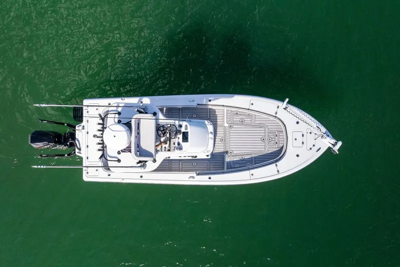 Slide: The Image of Aerial view of 2020 Barker Boatworks 26 Open on green water. - 3