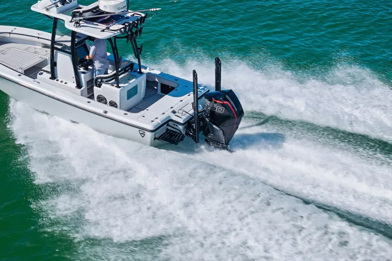 Slide: The Image of 2020 Barker Boatworks 26 Open cruising on clear blue water. - 39