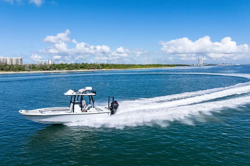 Slide: The Image of 2020 Barker Boatworks 26 Open cruising on clear blue water under a sunny sky. - 43
