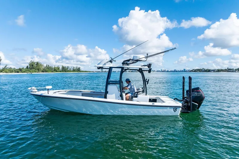Slide: The Image of 2020 Barker Boatworks 26 Open on calm water under a clear blue sky. - 8