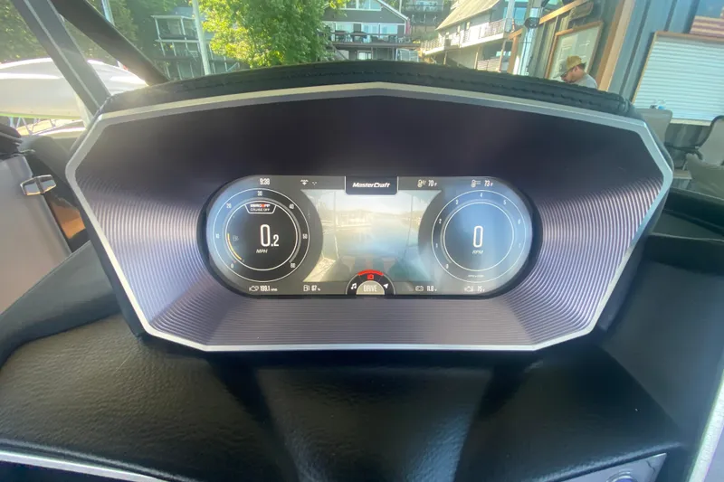 Slide: The Image of 2021 MasterCraft XT25 dashboard display showing speed and RPM gauges. - 24