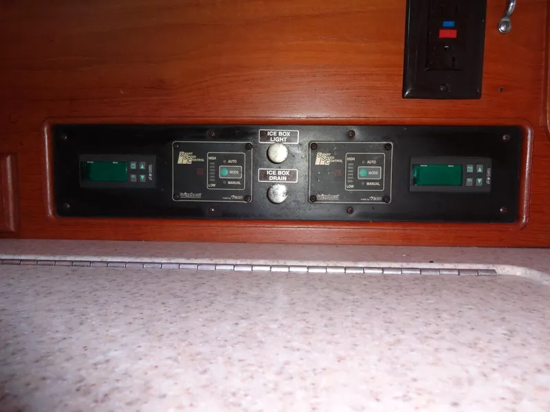 Slide: The Image of Control panel on 2006 Island Packet 440 yacht, featuring digital displays and switches. - 10