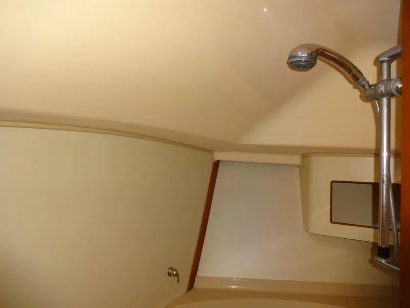 Slide: The Image of Interior shower area of 2006 Island Packet 440 yacht, featuring a sleek showerhead. - 39