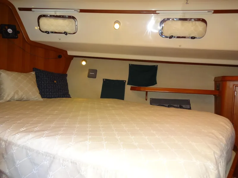 Slide: The Image of Cozy cabin interior of 2006 Island Packet 440 sailboat with comfortable bedding. - 46