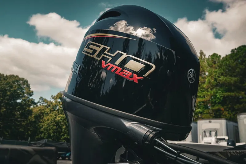 Slide: The Image of 2026 G3 Sportsman 1710 with Yamaha SHO VMAX outboard motor, outdoors under cloudy sky. - 11