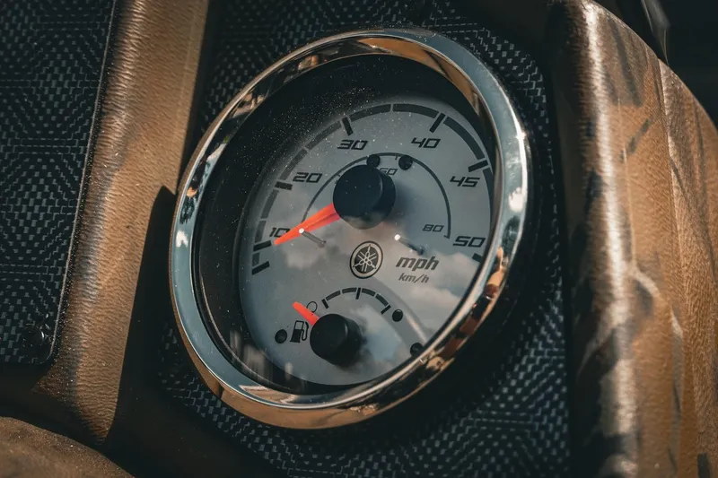 Slide: The Image of Close-up of 2026 G3 Sportsman 1710 speedometer, displaying mph and km/h. - 13