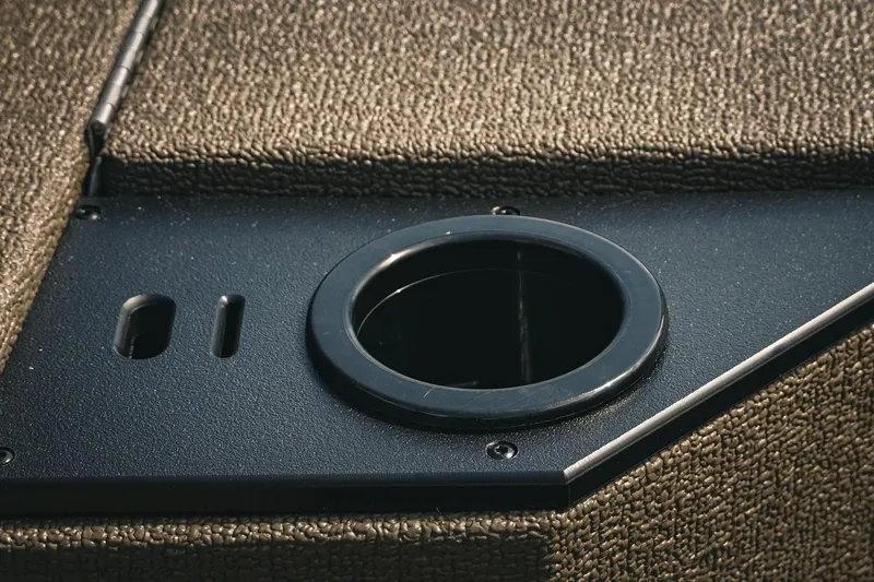 Slide: The Image of 2026 G3 Sportsman 1710 boat detail with cup holder and textured surface. - 16