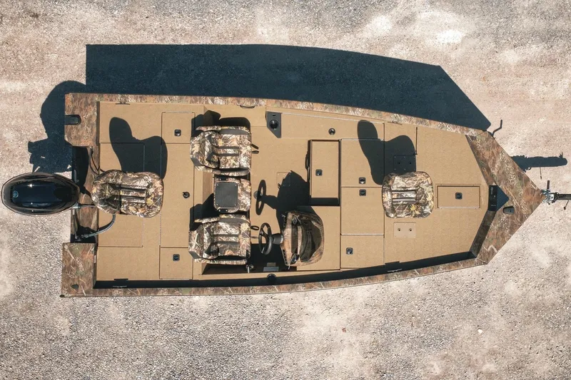 Slide: The Image of 2026 G3 Sportsman 1710 boat, aerial view, camo seats, spacious deck, outboard motor. - 2