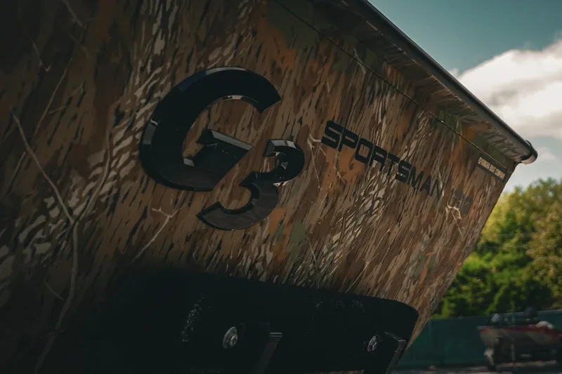 Slide: The Image of 2026 G3 Sportsman 1710 boat with camouflage design, close-up view. - 21