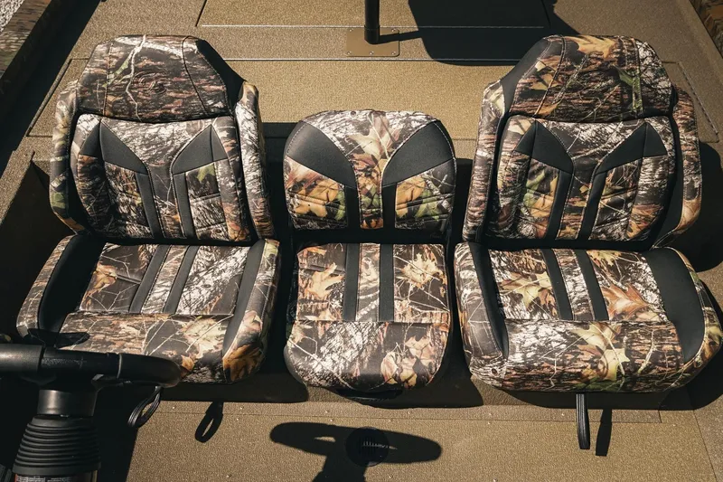 Slide: The Image of Camouflage seats in a 2026 G3 Sportsman 1710 boat, arranged in a row. - 25