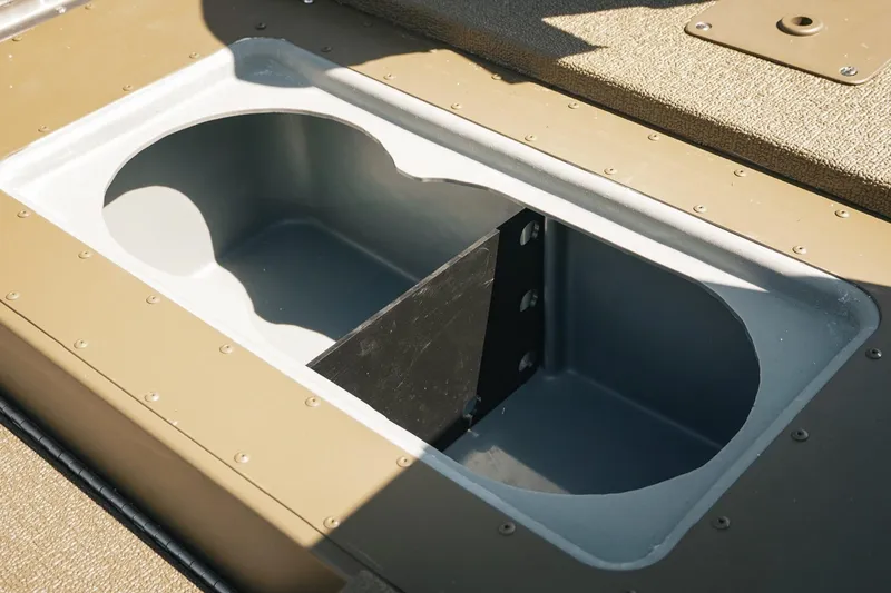 Slide: The Image of 2026 G3 Sportsman 1710 boat storage compartment with dual openings. - 26