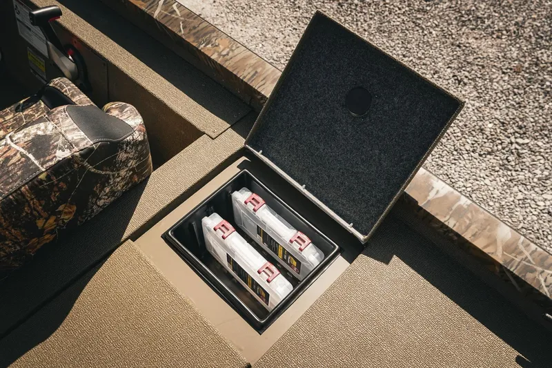 Slide: The Image of Storage compartment in 2026 G3 Sportsman 1710 boat with organized tackle boxes. - 29