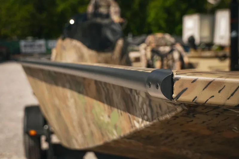 Slide: The Image of 2026 G3 Sportsman 1710 boat with camouflage design, close-up view. - 40