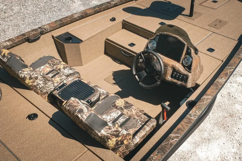 Slide: The Image of 2026 G3 Sportsman 1710 boat interior with camouflage seats and steering console. - 5