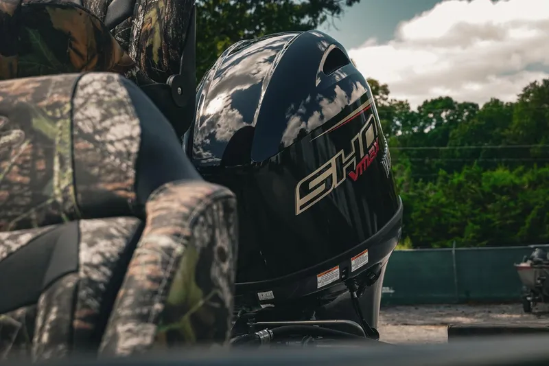 Slide: The Image of 2026 G3 Sportsman 1710 boat with camo seats and powerful outboard motor. - 7