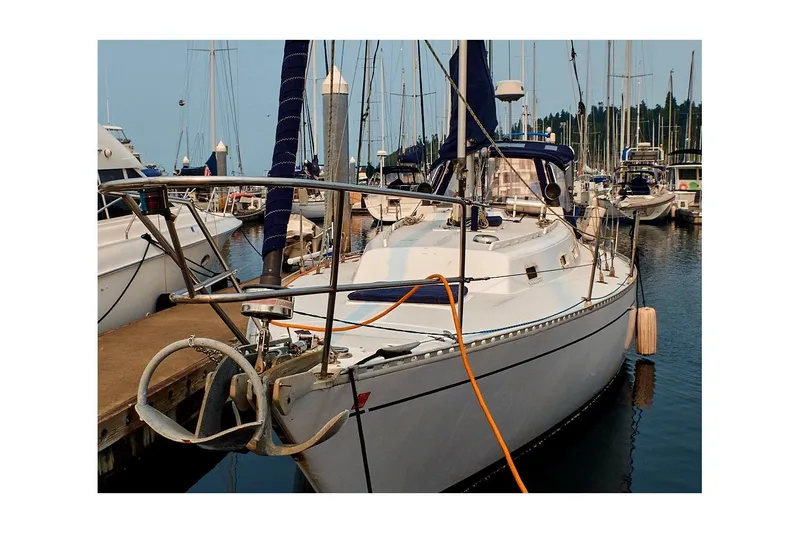 The Image of 1981 Jensen Marine/Cal Boats 39 MK III sailboat docked in a marina. - 0