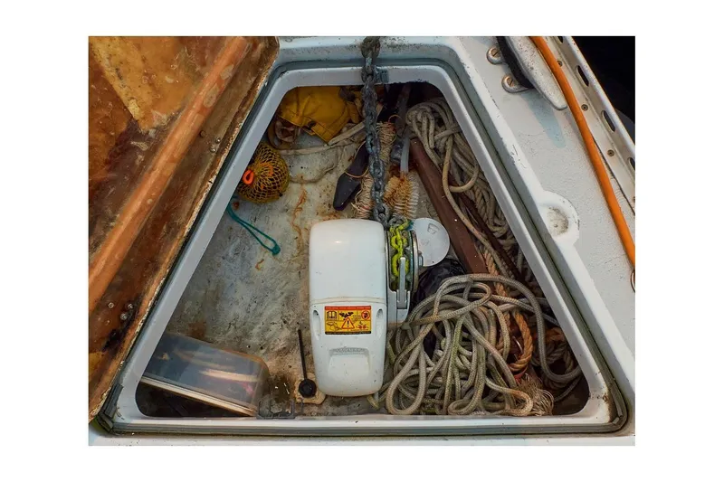 Slide: The Image of Anchor locker of 1981 Jensen Marine Cal 39 MK III with ropes and equipment. - 11