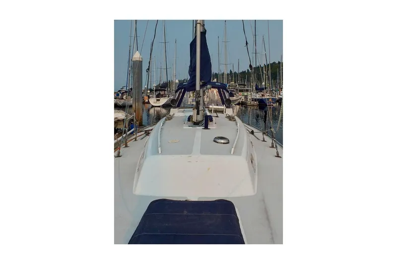 Slide: The Image of 1981 Jensen Marine/Cal Boats 39 MK III sailboat docked in a marina. - 13