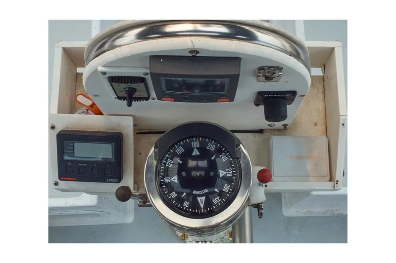 Slide: The Image of 1981 Jensen Marine/Cal Boats 39 MK III helm with compass and navigation instruments. - 19