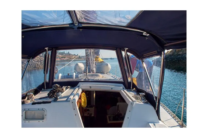Slide: The Image of 1981 Jensen Marine/Cal Boats 39 MK III sailboat cockpit view with canopy and waterway. - 28