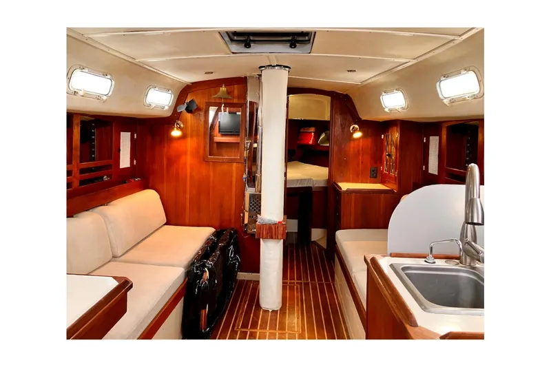 Slide: The Image of Interior of 1981 Jensen Marine Cal 39 MK III sailboat with wood finish and cozy seating. - 29