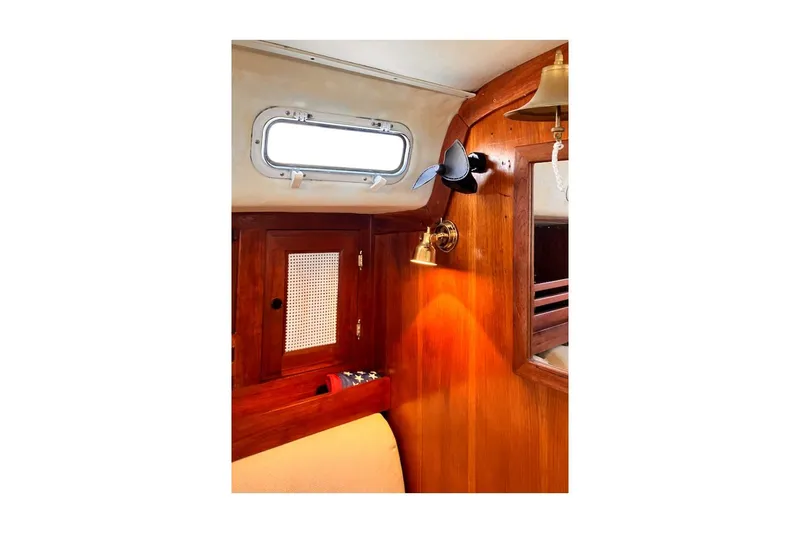 Slide: The Image of Interior of 1981 Jensen Marine/Cal Boats 39 MK III with wooden cabinetry and nautical decor. - 31