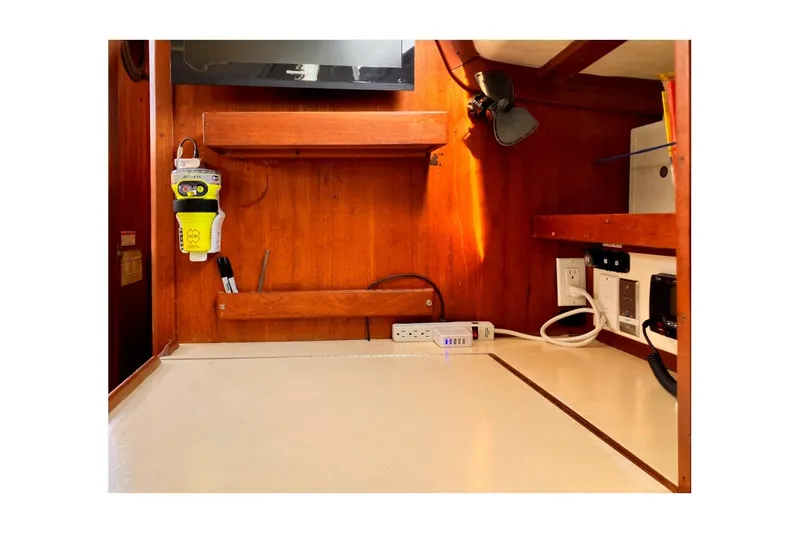 Slide: The Image of 1981 Jensen Marine/Cal Boats 39 MK III interior with wooden cabinetry and electrical outlets. - 38