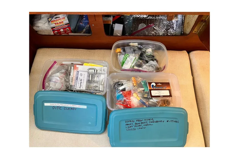 Slide: The Image of Organized storage boxes with boat repair supplies on a 1981 Jensen Marine/Cal Boats 39 MK III. - 46
